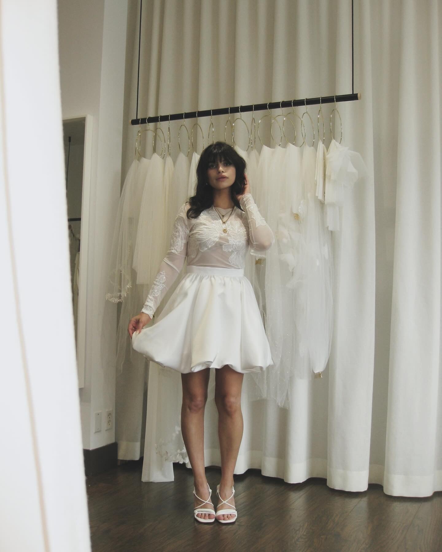 Bride is wearing wedding skirt set at TEMPÊTE Bridal Boutique Vancouver