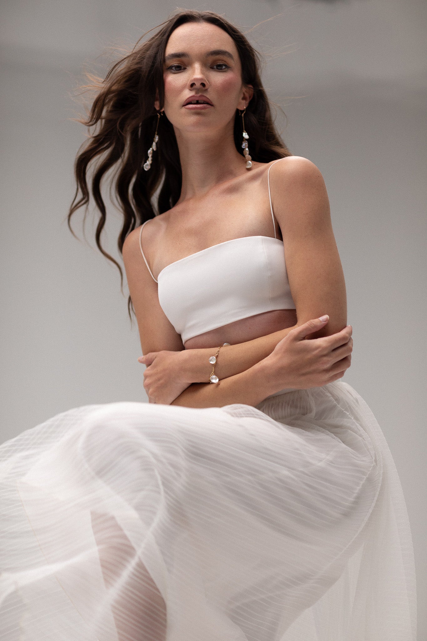 Close up of a bridal skirt on a model by TEMPÊTE Bridal Boutique