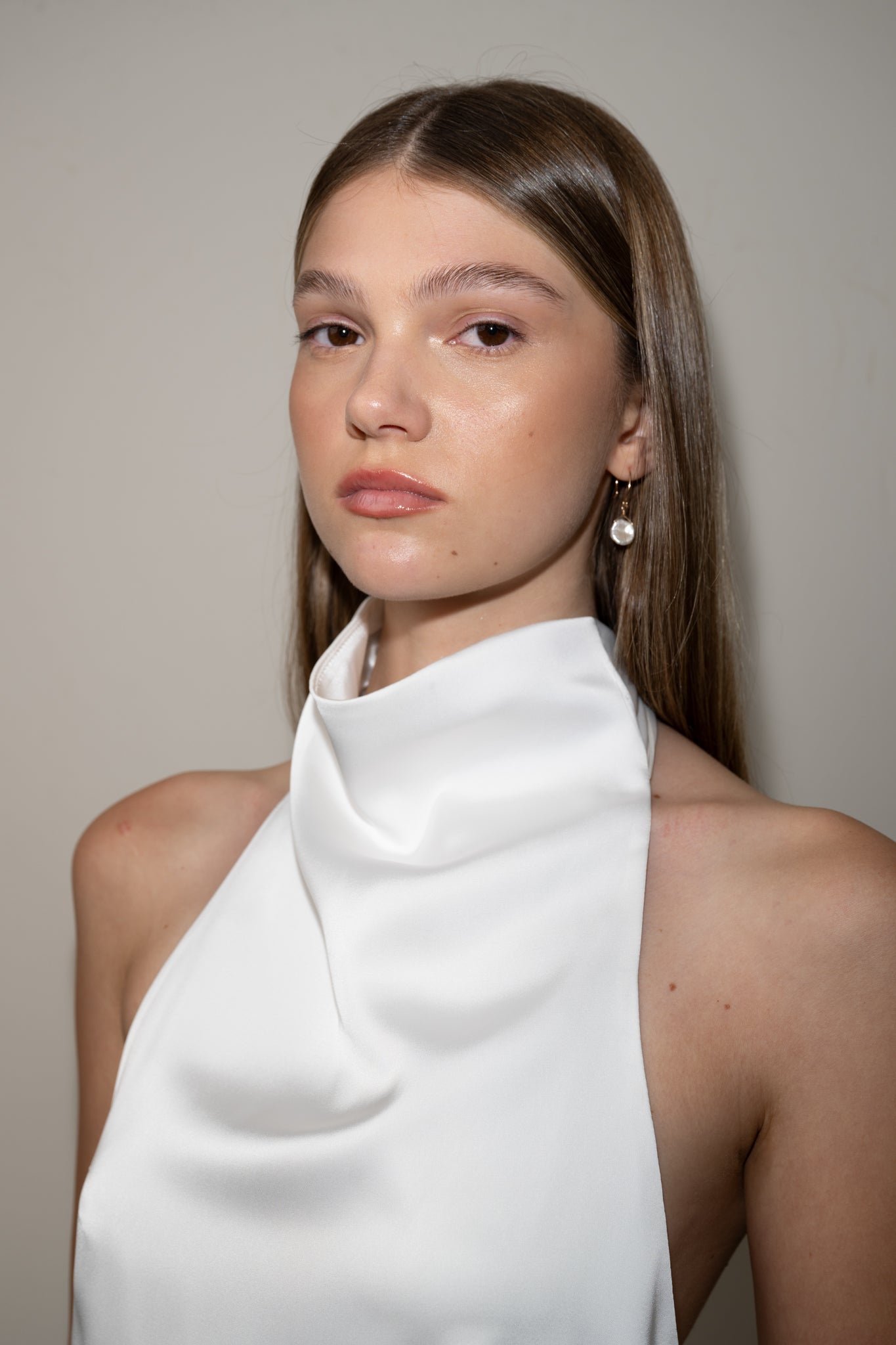 Bride is wearing a Halter Neck Satin Top by TEMPÊTE