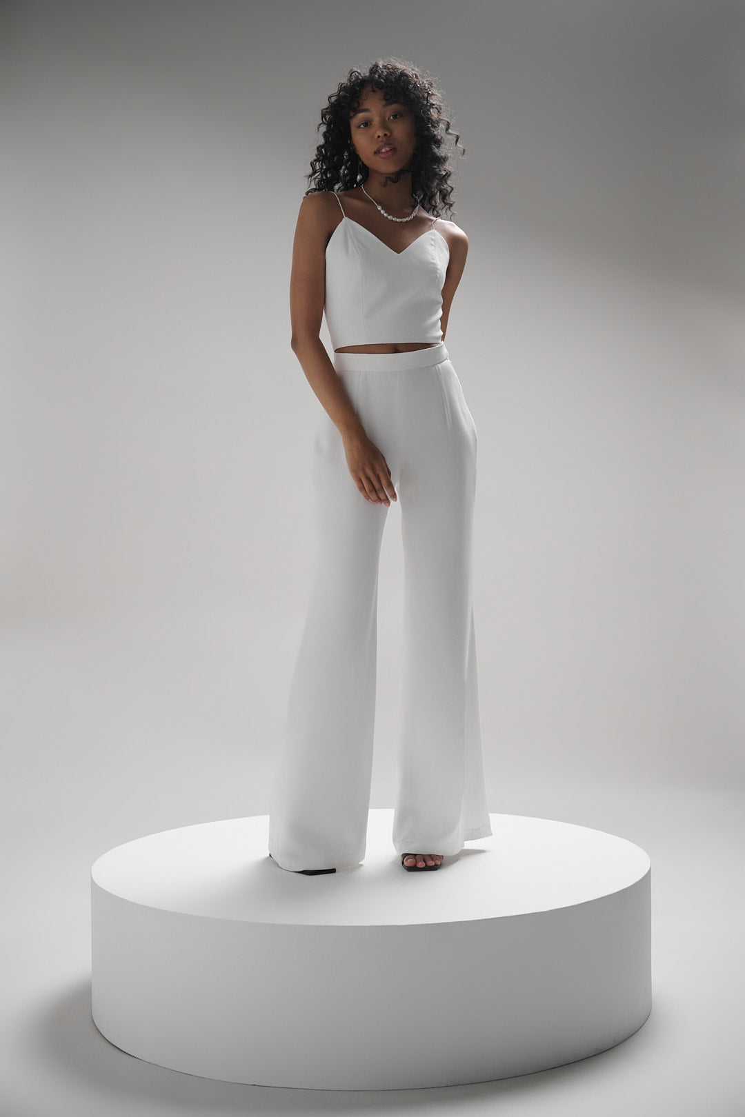 Giverny pants offer a universally flattering fit with a high natural waist, fitted hips, and flowy wide leg. Perfectly comfortable and chic for any modern bride.