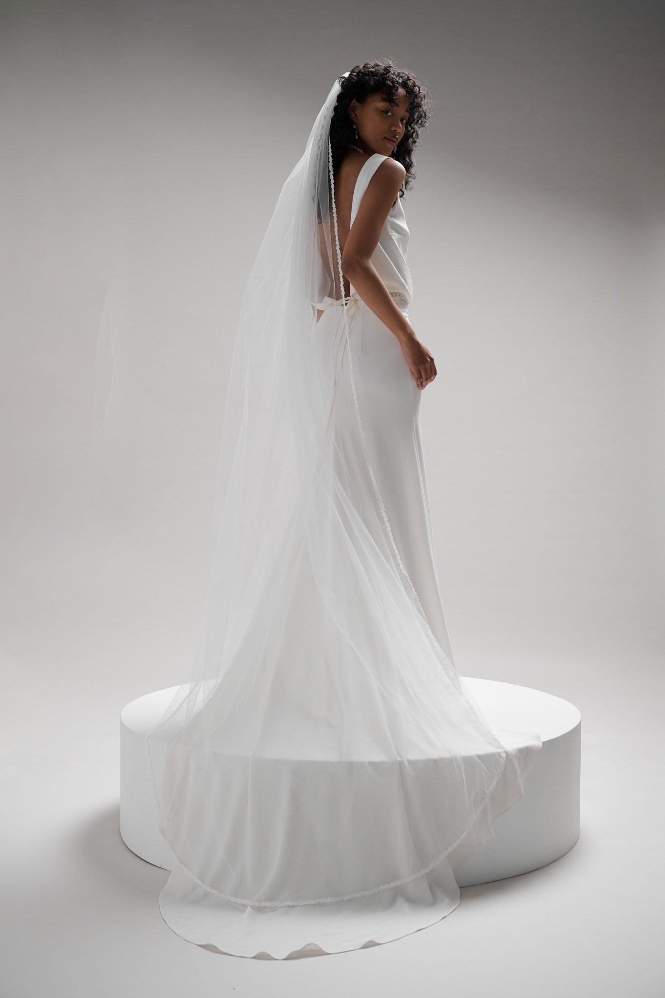 Floral lace trimmed veil with soft tulle base that drapes beautifully and appears to float in the wind.