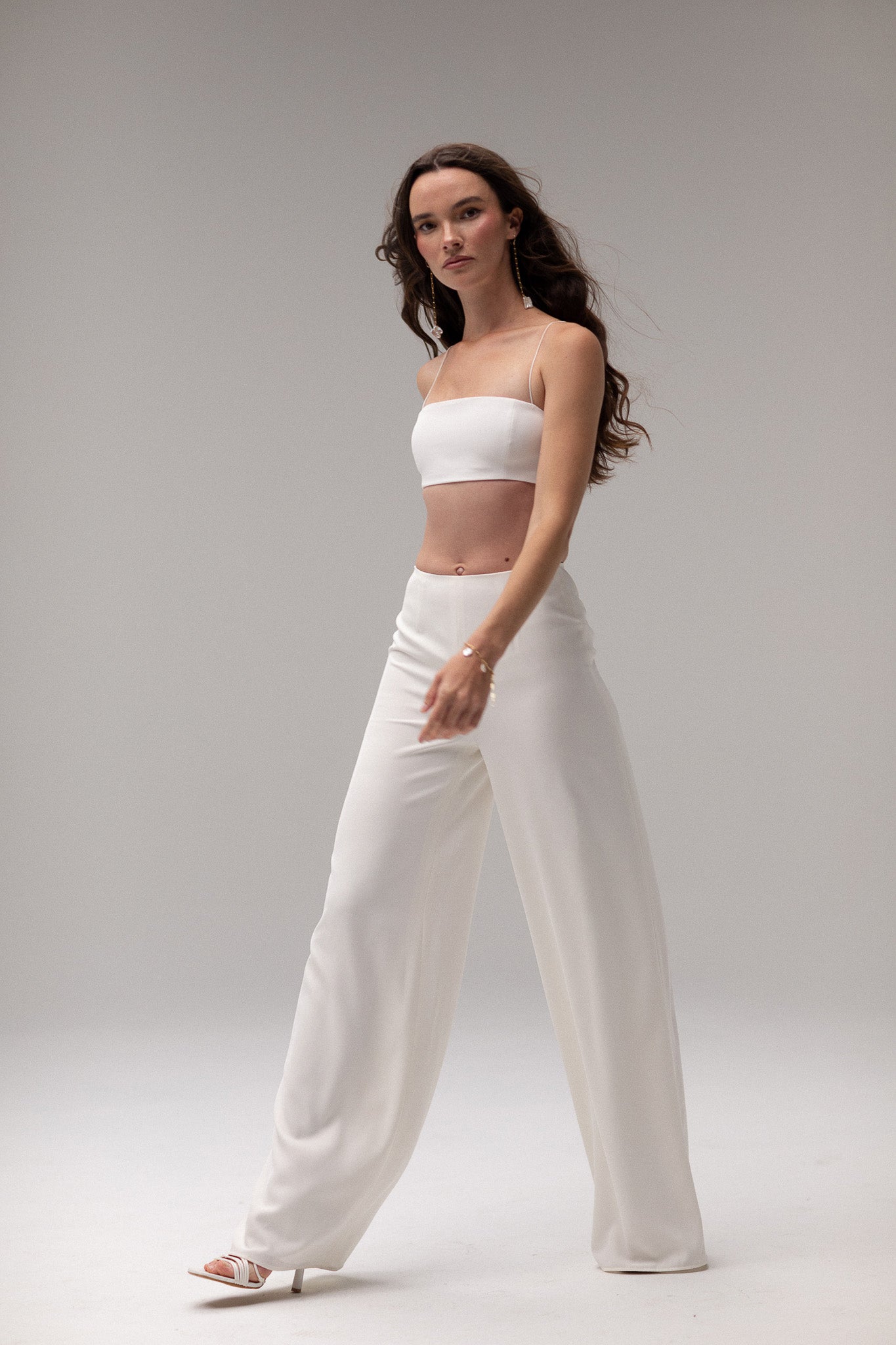 Close-up of wide-leg high-rise pants, offering a flattering and versatile design, perfect for creating a modern wedding outfit by TEMPÊTE