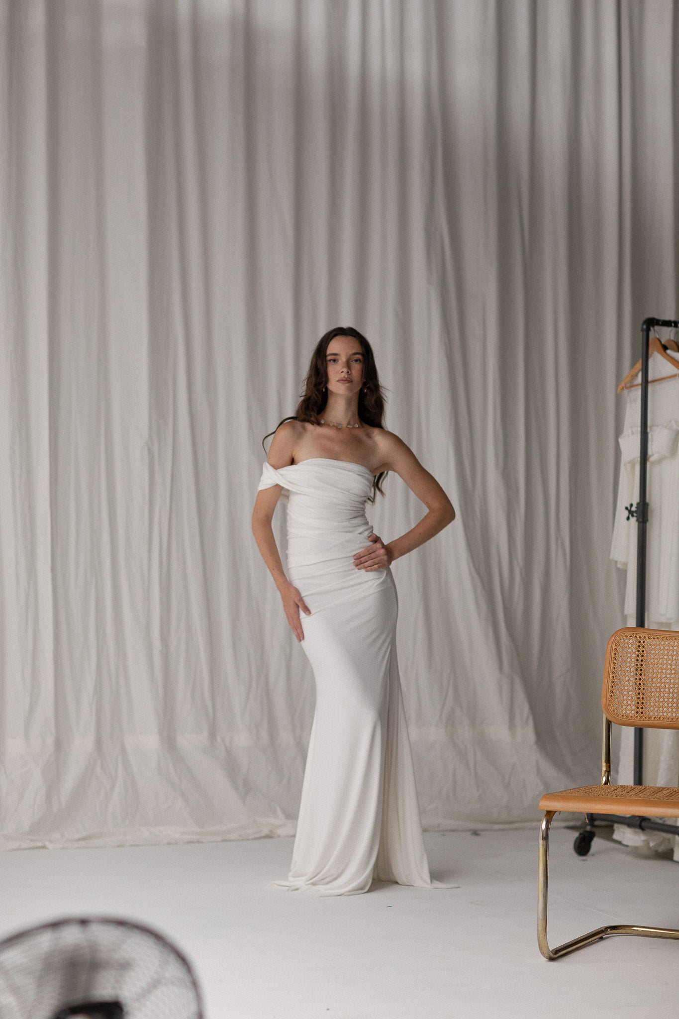 Bride in a draped knit slit skirt from TEMPÊTE, showcasing a fitted silhouette with a stylish slit, ideal for a bold and contemporary bridal outfit