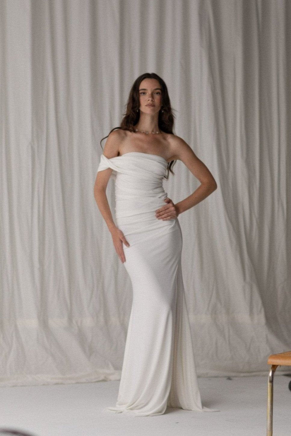 Bride in a draped knit slit skirt from TEMPÊTE, showcasing a fitted silhouette with a stylish slit, ideal for a bold and contemporary bridal outfit