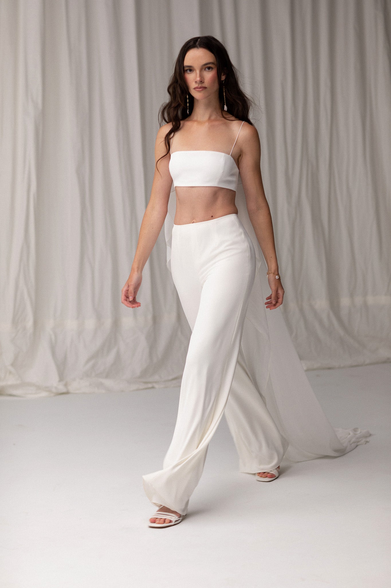 Close-up of wide-leg high-rise pants, offering a flattering and versatile design, perfect for creating a modern wedding outfit by TEMPÊTE