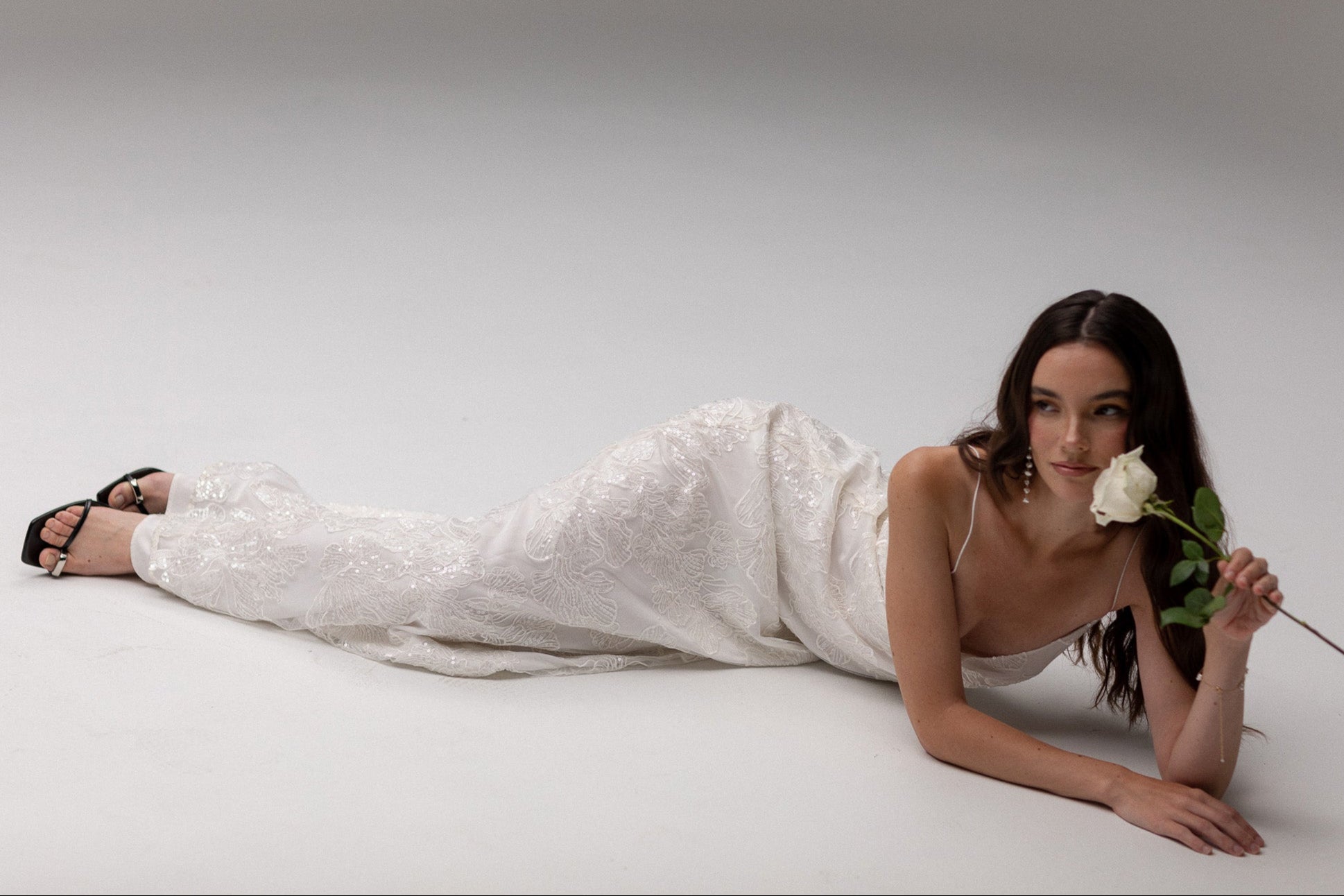 Bride in a wedding dress holding a flower