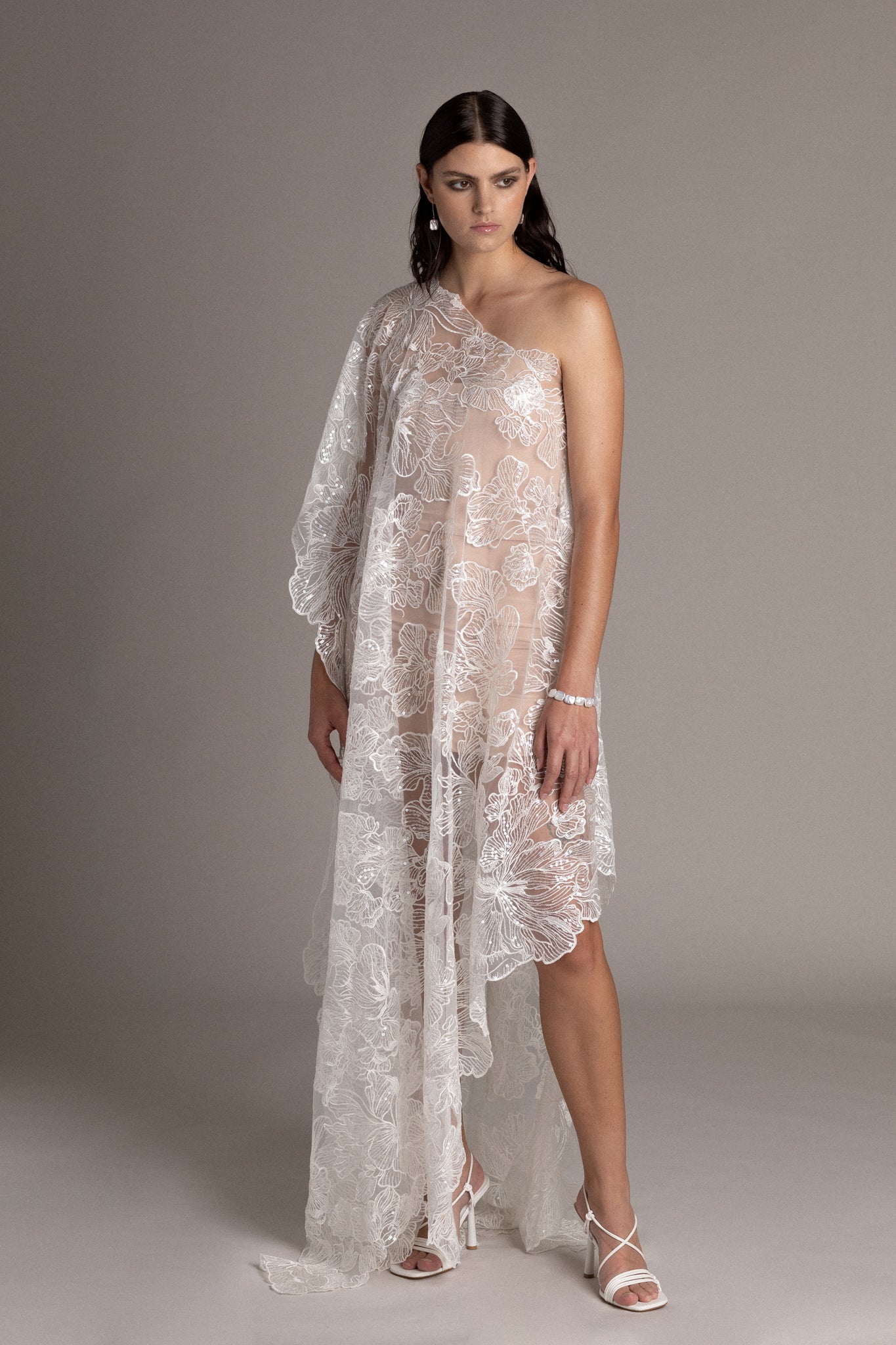 Asymmetric Couture Dress is meticulously crafted for the woman who seeks to make a statement on her wedding day. The asymmetric silhouette creates an artful balance between sophistication and daring. 