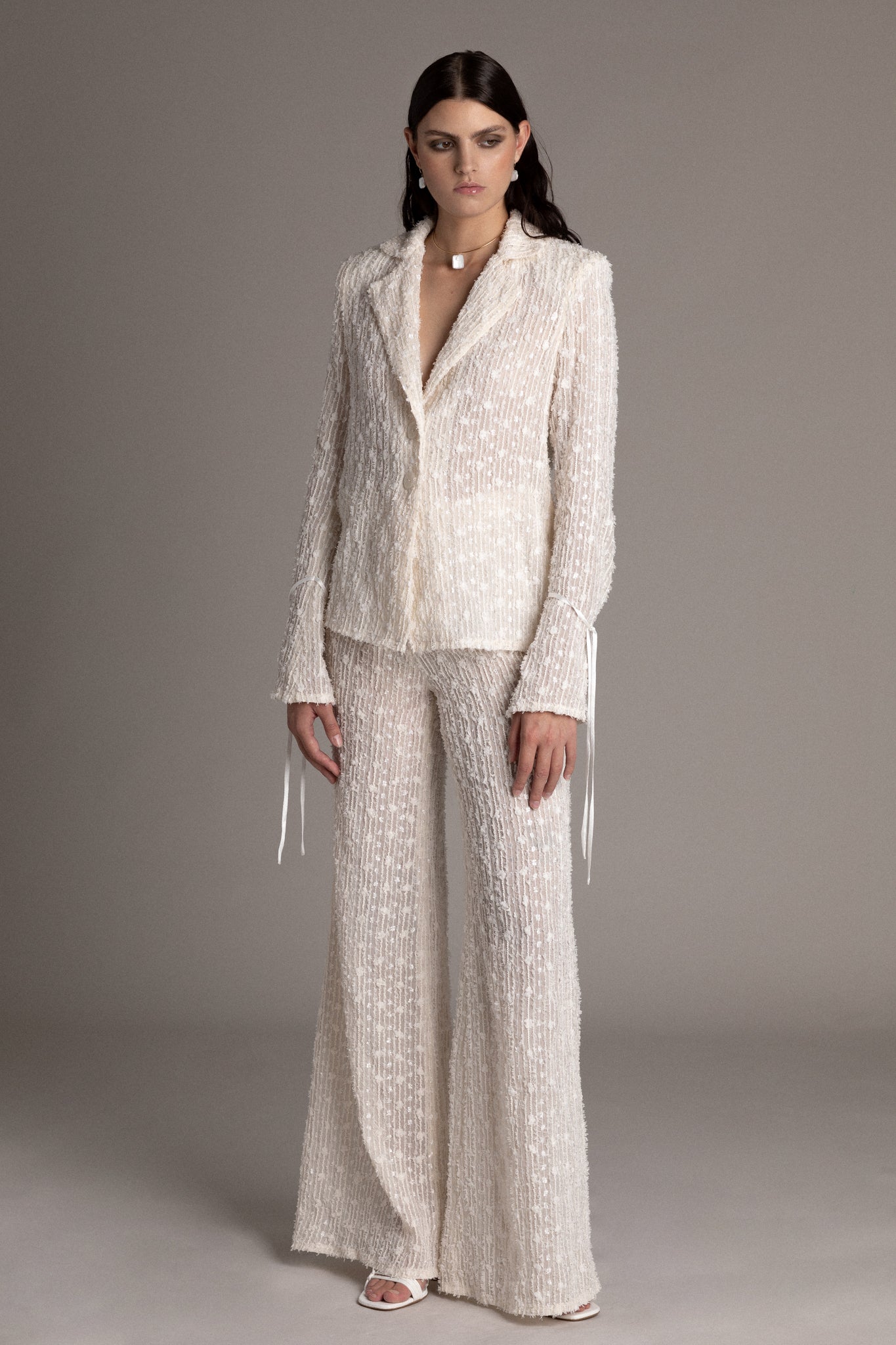 These pants showcase a timeless palazzo silhouette enhanced by a one-of-a-kind textile.