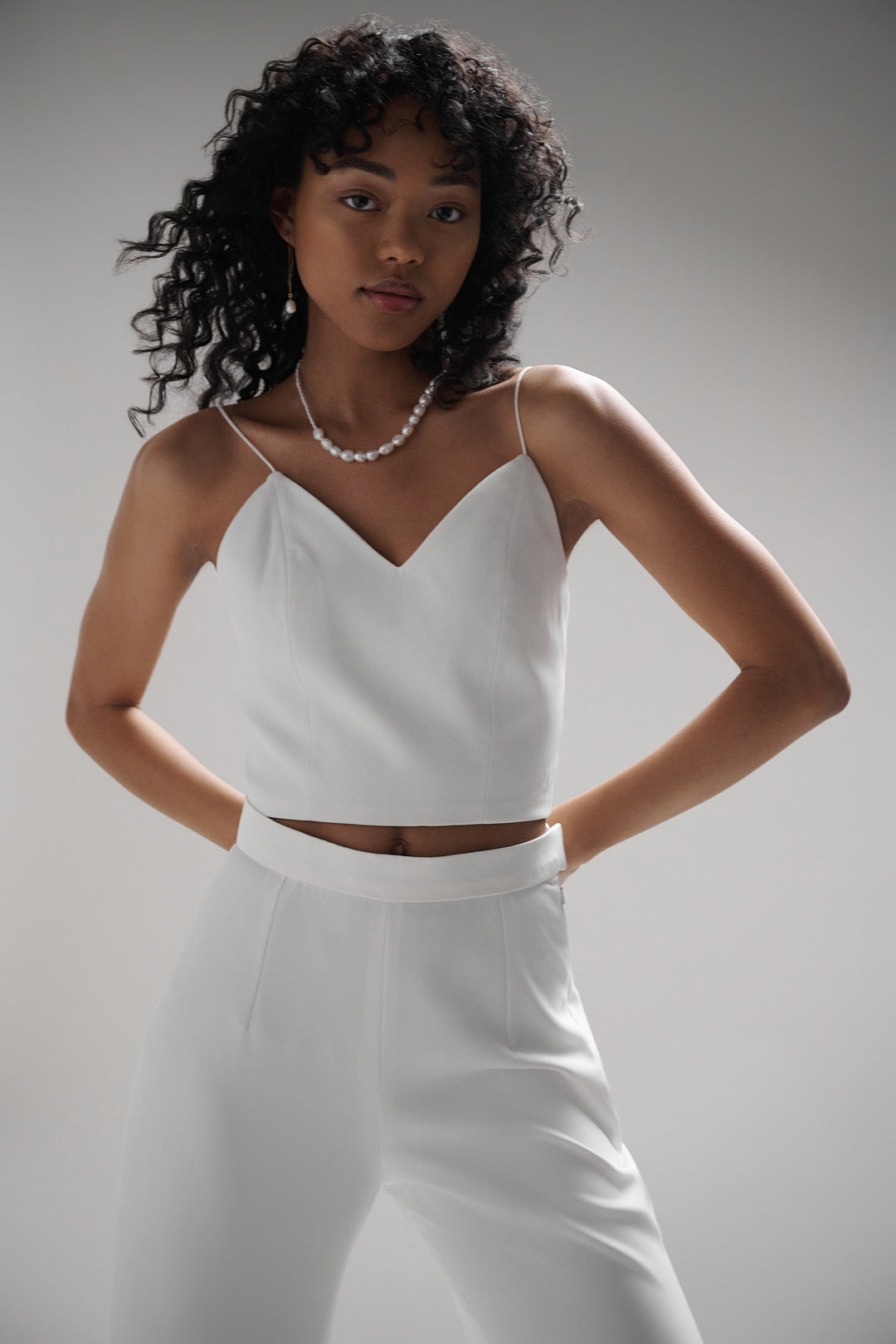 A luxurious crepe top with clean lines and a simple yet sophisticated design. The Dauphine top is a modern and chic addition to any bridal wardrobe, perfect for the fashion-forward bride.
