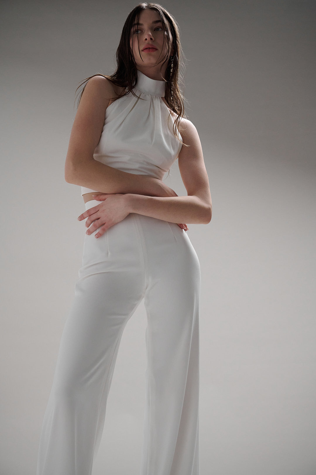 Giverny pants offer a universally flattering fit with a high natural waist, fitted hips, and flowy wide leg. Perfectly comfortable and chic for any modern bride.