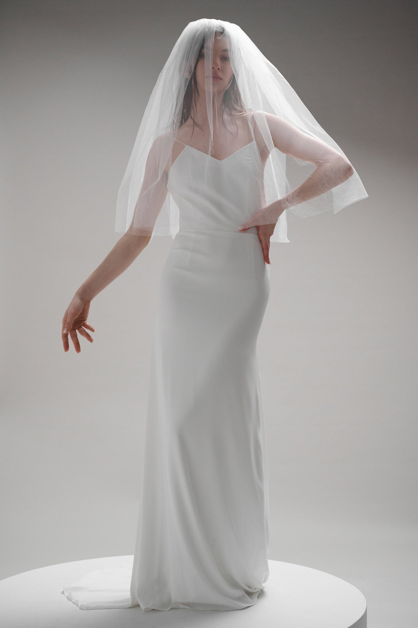 A playful, 60s-inspired veil featuring two 30-inch blunt layers of fine tulle, finished with a gold comb.