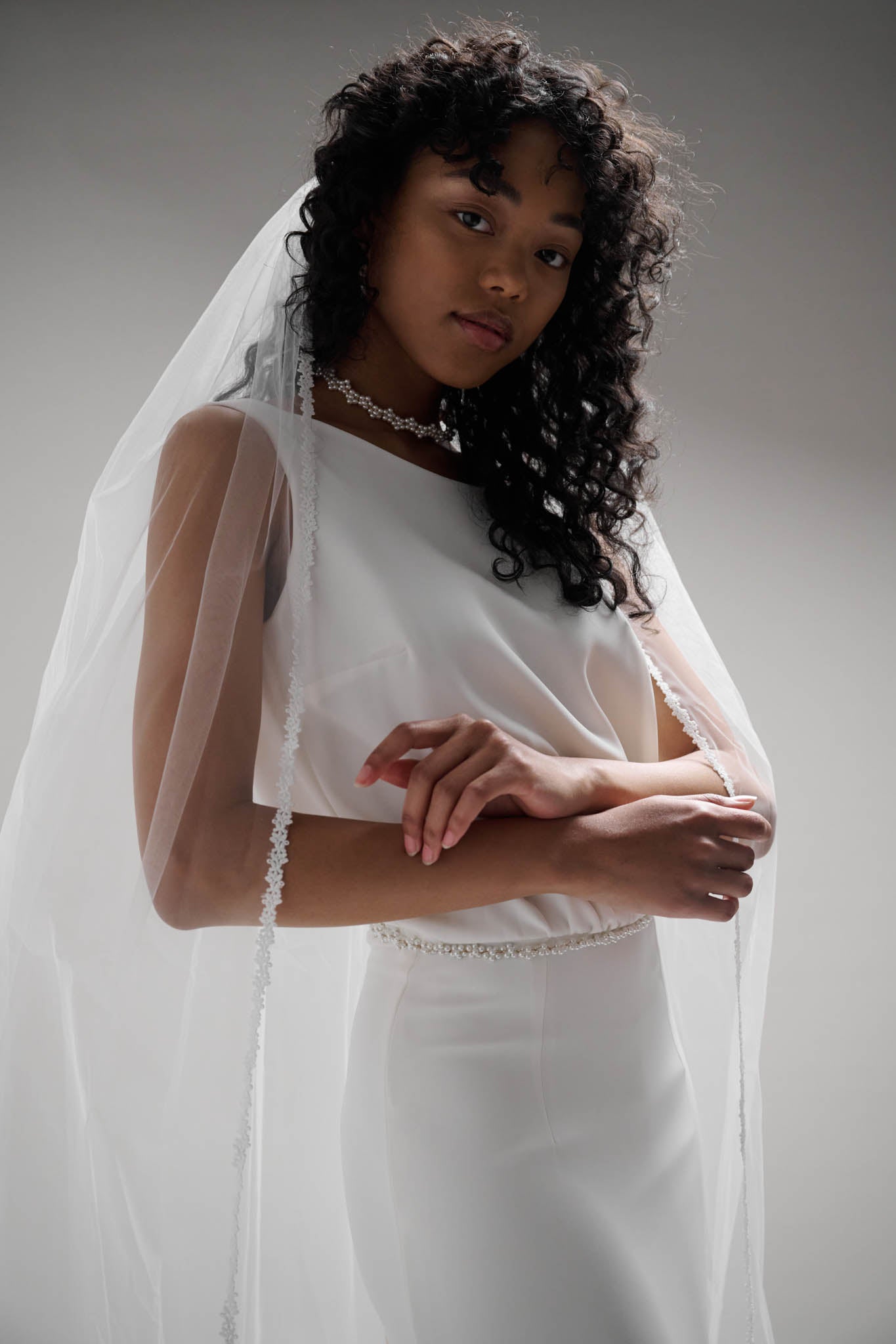 Floral lace trimmed veil with soft tulle base that drapes beautifully and appears to float in the wind.