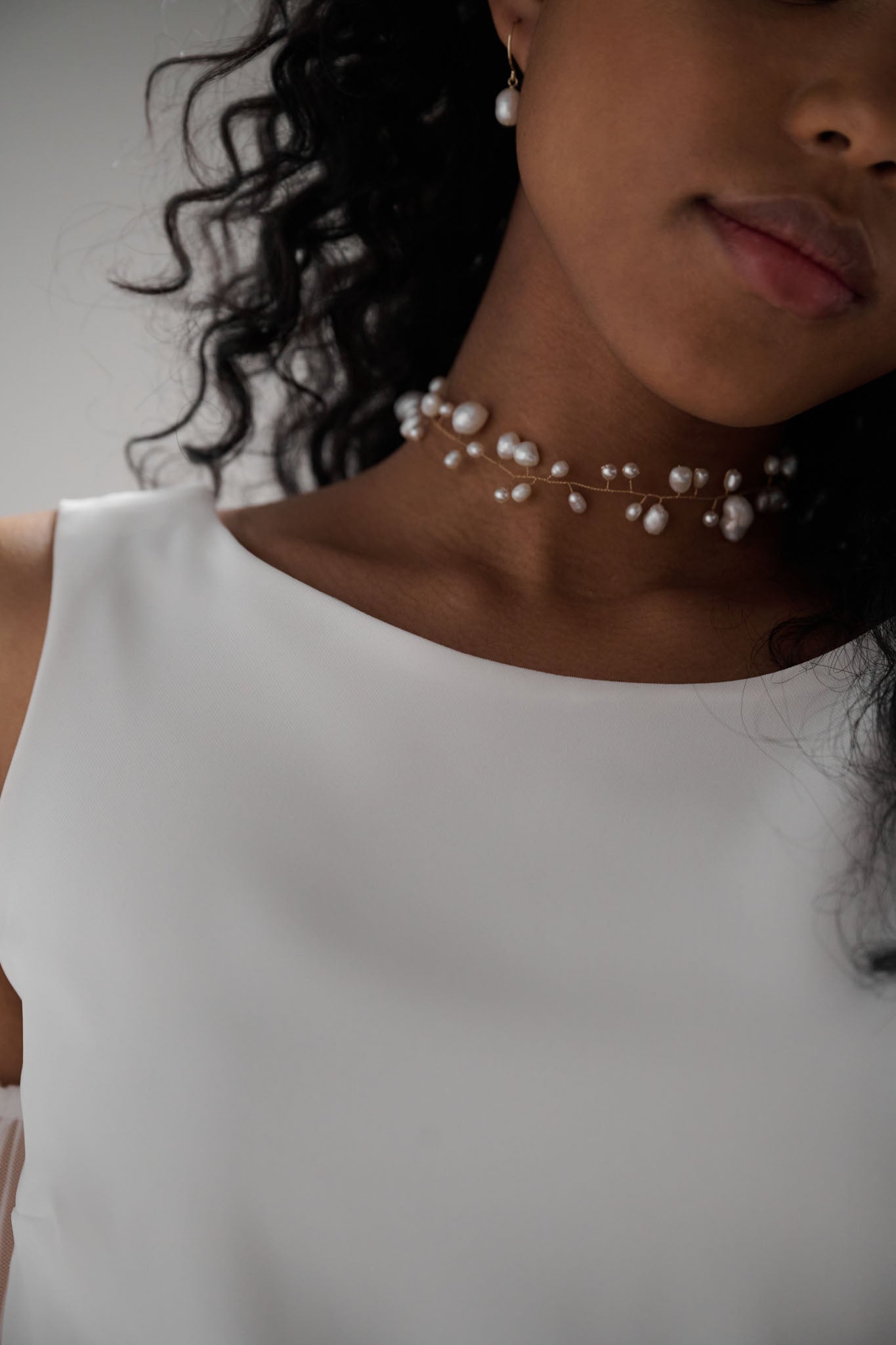 Cluster pearl choker features a dazzling array of delicately arranged pearls in your choice of gold or silver 
