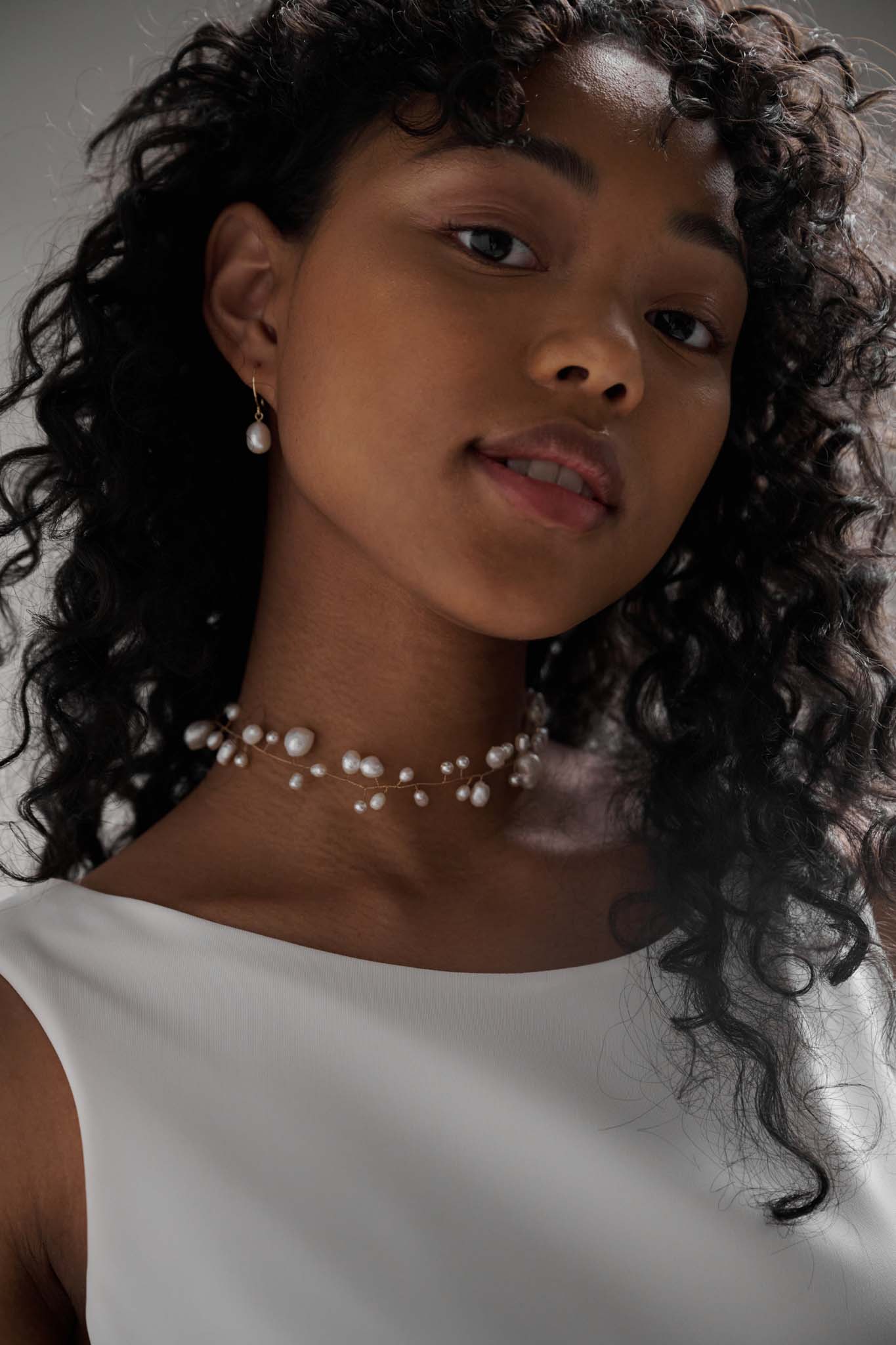 Cluster pearl choker features a dazzling array of delicately arranged pearls in your choice of gold or silver 