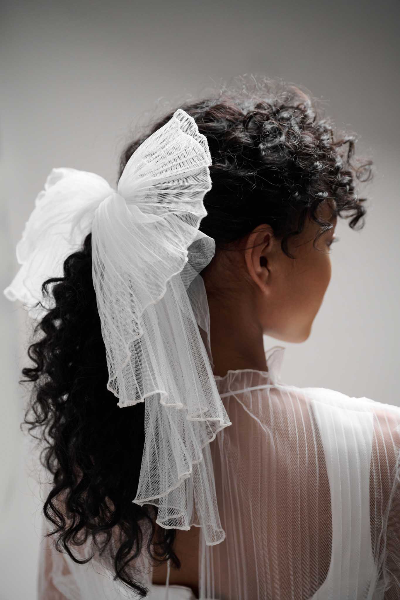 This Pleated bow adds a classic, effortless look to any hairstyle, style it in a sleek ponytail or minimalist bridal look