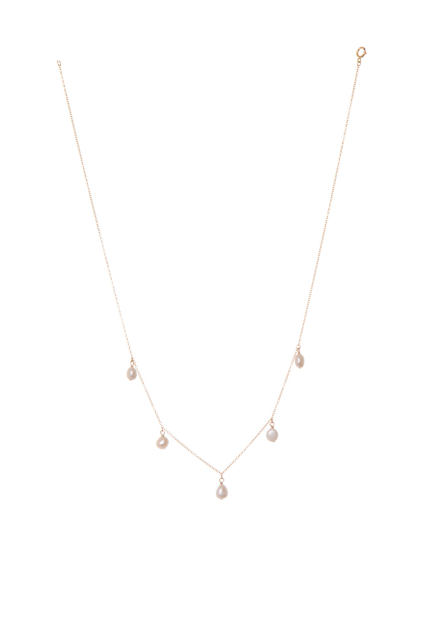 The Stargaze necklace is a beautiful piece of jewelry featuring five freshwater pearls on a delicate chain. This timeless design combines vintage charm with a modern, minimalist look.