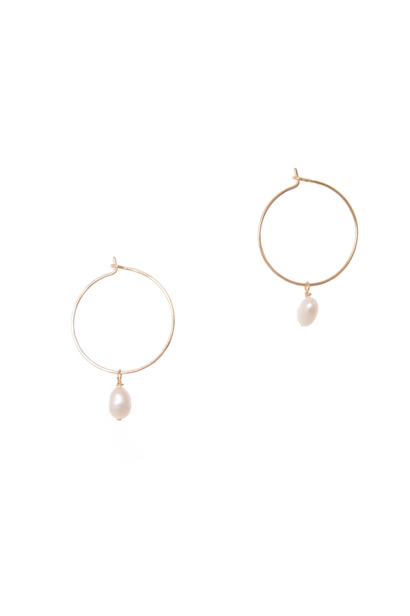 Full Moon Hoops features freshwater pearl strung along 14k gold-filled, hand-formed hoops. Perfect for special occasions and everyday wear