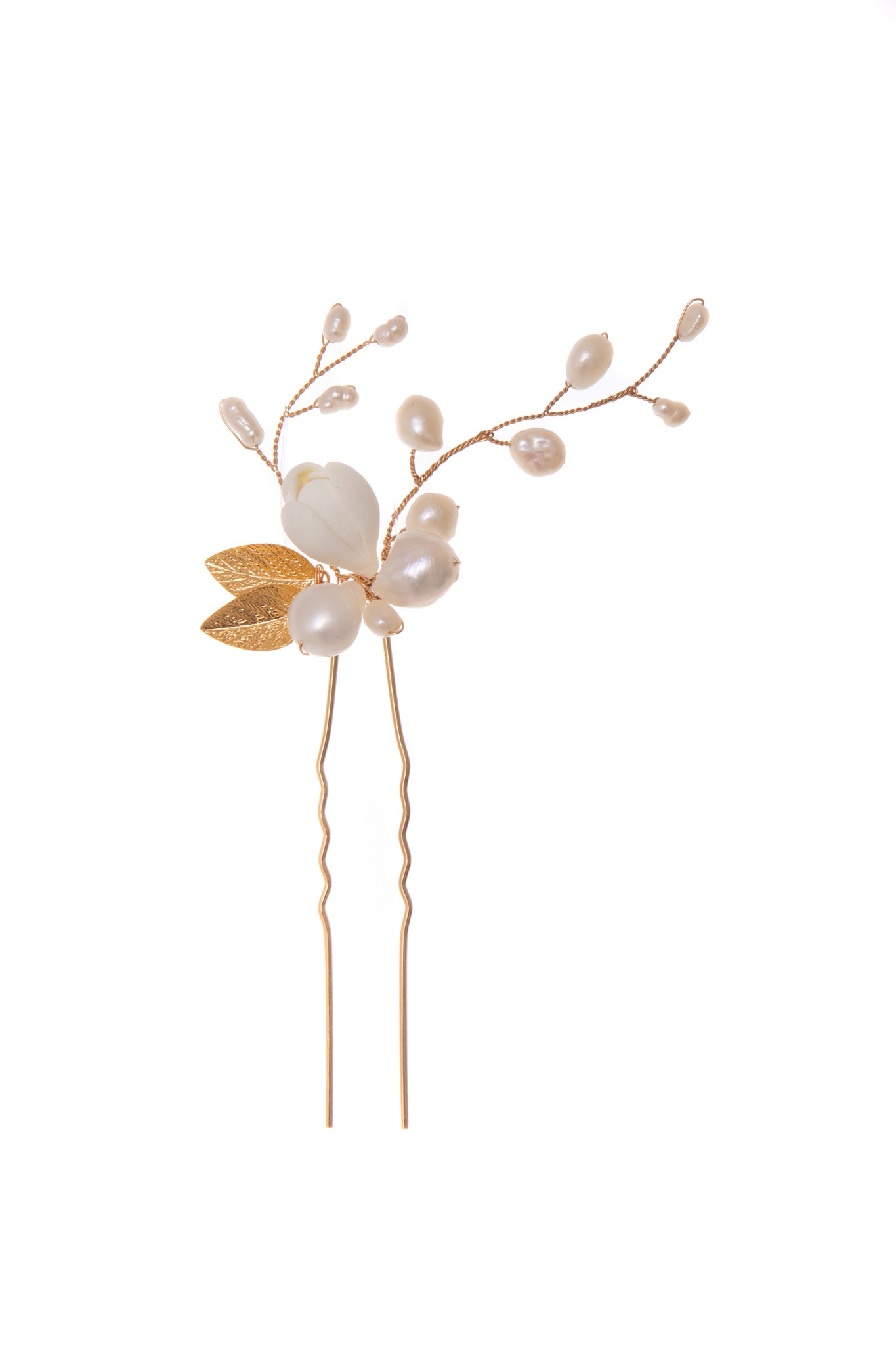 Wildflower hair pin features delicate petals and freshwater pearls that flare out gracefully from the central bud, creating a subtle yet sophisticated piece that will bring an exquisite finish to any look