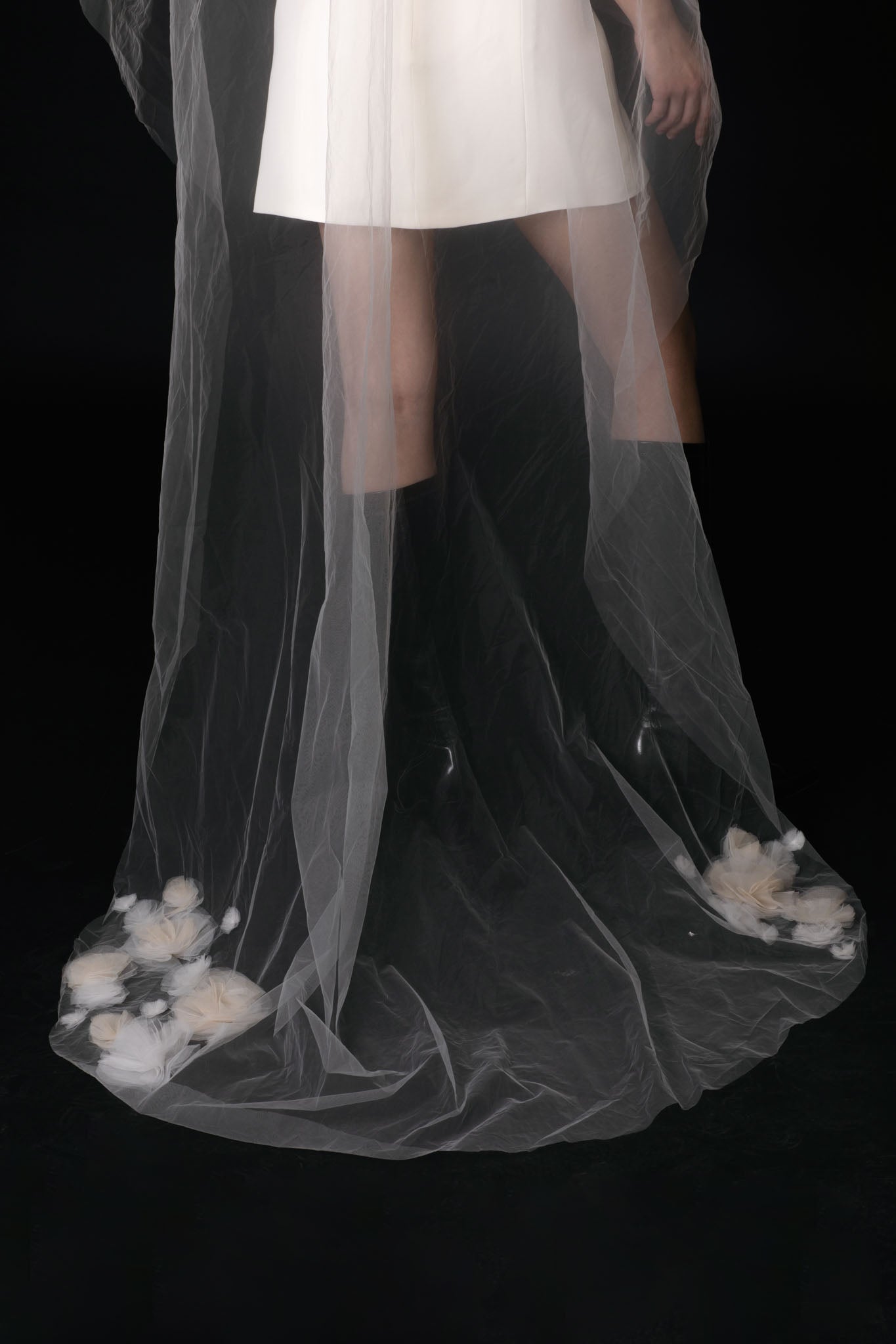 Jardin drop veil, featuring delicate handmade tulle flowers, is the perfect statement piece for the bride who wants to stand out on her wedding day