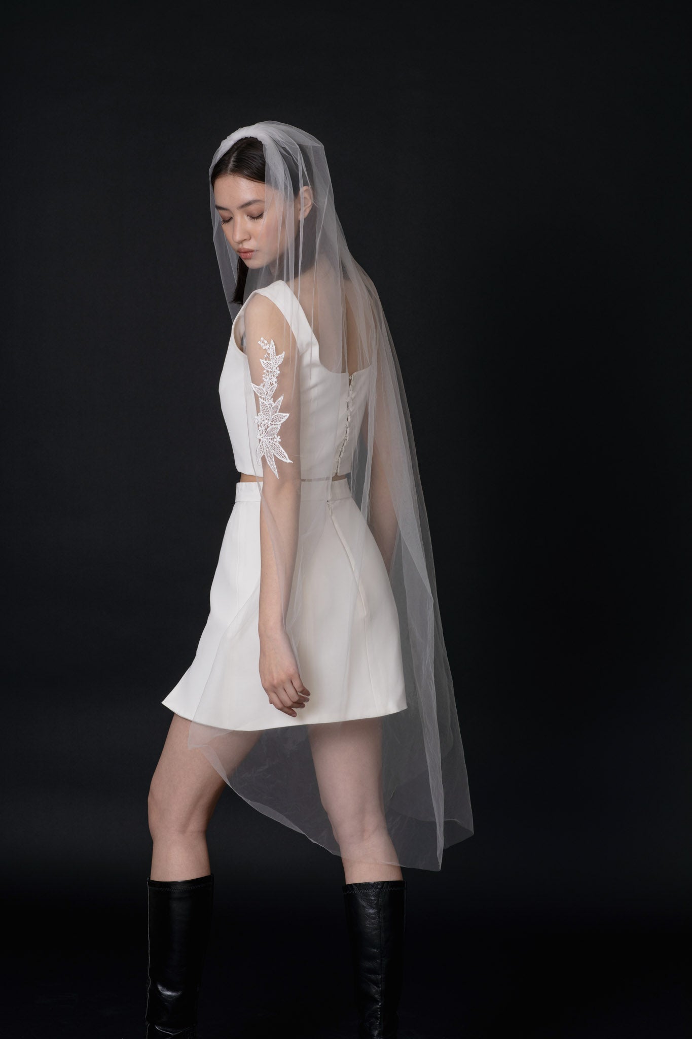 Modern ethereal veil with floating leaf lace applique and soft tulle. Finished with a gold comb. Perfect for a contemporary and romantic bridal look